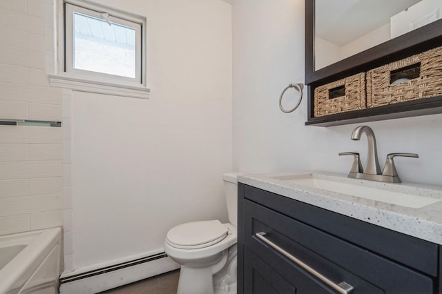 bathroom with vanity, a baseboard heating unit, a bath, and toilet