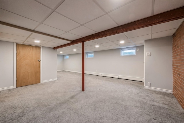 basement with a baseboard radiator and carpet floors