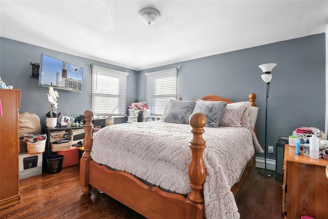 bedroom featuring dark hardwood / wood-style floors and baseboard heating