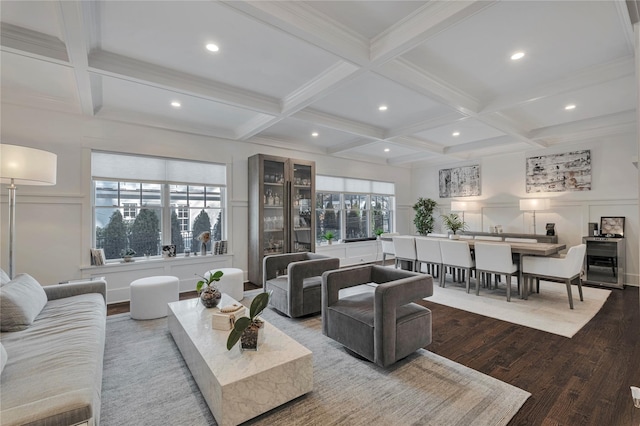 living room featuring coffered ceiling and beam ceiling