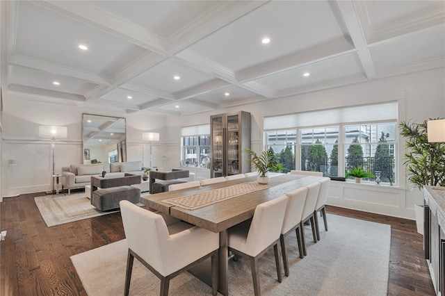 dining area featuring coffered ceiling, dark hardwood / wood-style flooring, and beamed ceiling