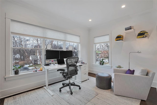 office space featuring ornamental molding and light hardwood / wood-style floors