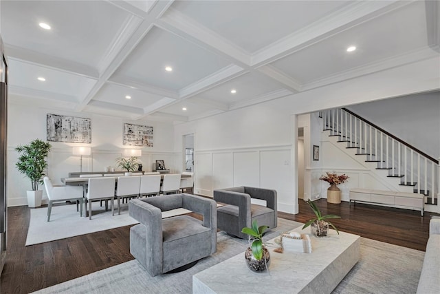 living room with beamed ceiling, coffered ceiling, and hardwood / wood-style flooring