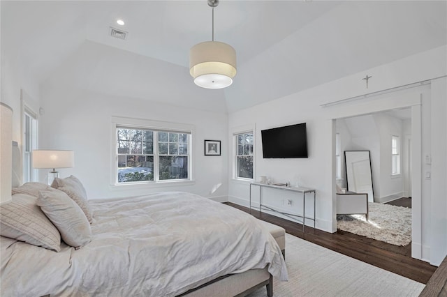 bedroom featuring dark hardwood / wood-style flooring and vaulted ceiling