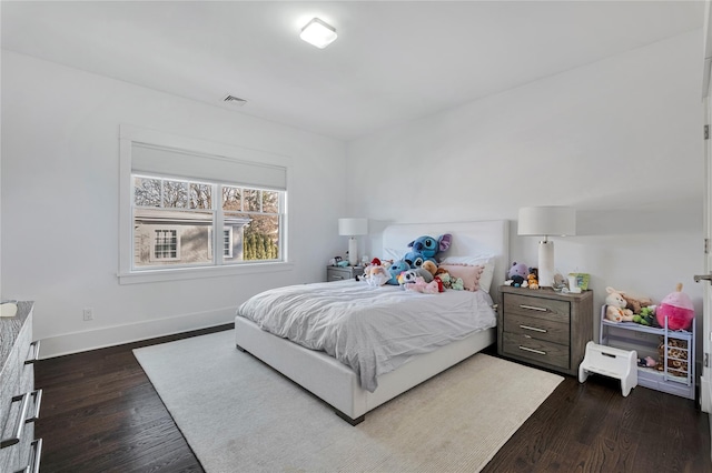 bedroom featuring dark hardwood / wood-style floors