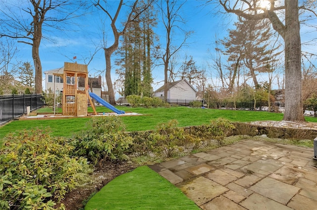 view of yard with a playground and a patio area