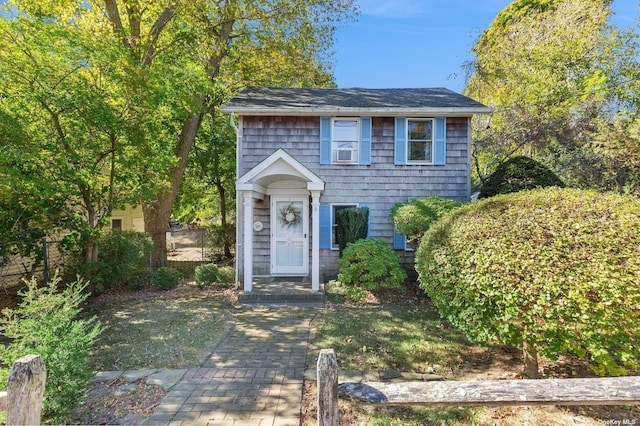 view of front of home featuring cooling unit