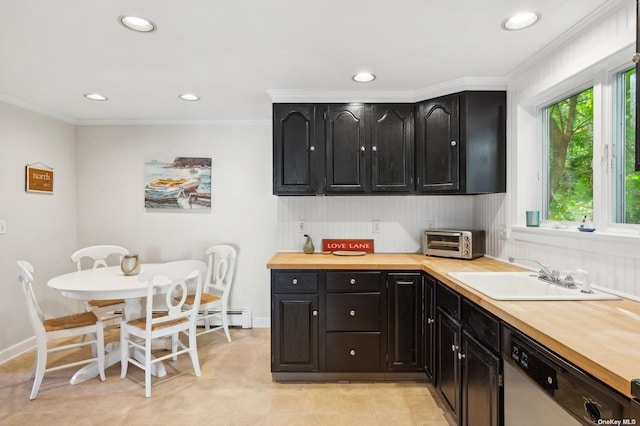 kitchen with sink, ornamental molding, wooden counters, and dishwasher