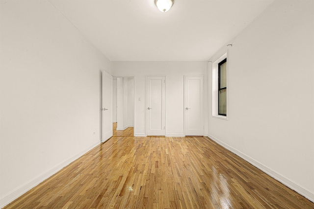 unfurnished bedroom featuring light wood-type flooring