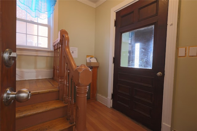 interior space with crown molding and light wood-type flooring