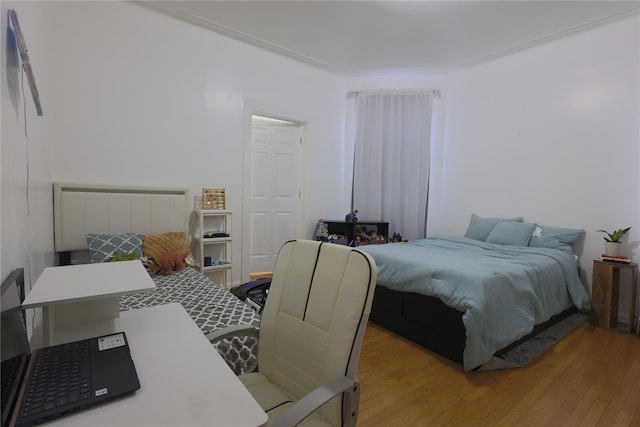 bedroom with light wood-type flooring