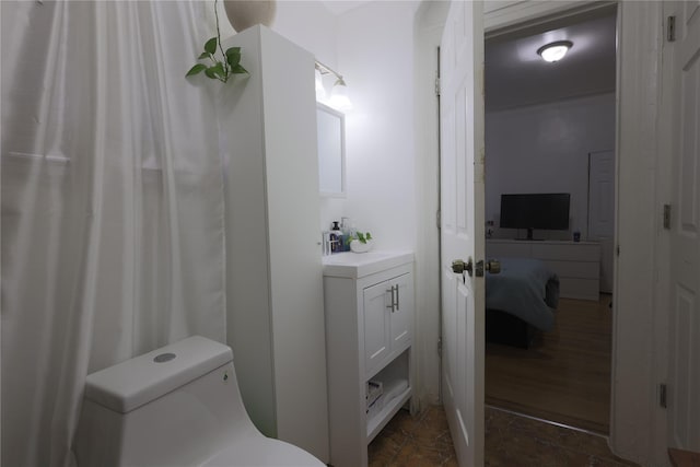 bathroom with vanity and toilet