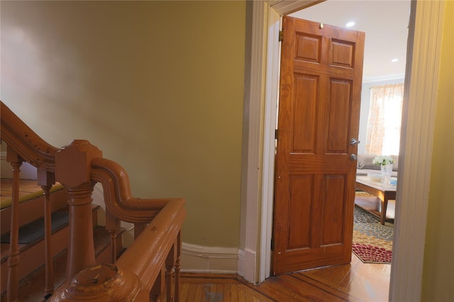 hallway featuring ornamental molding