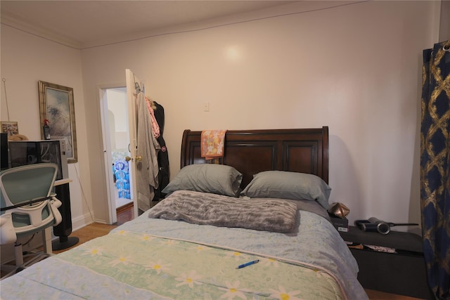 bedroom with wood-type flooring