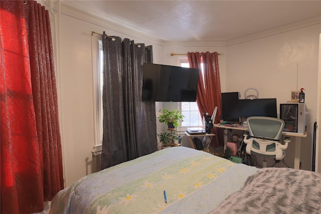 bedroom with crown molding