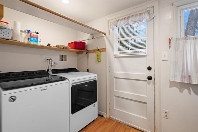 washroom featuring washer and dryer and light hardwood / wood-style flooring