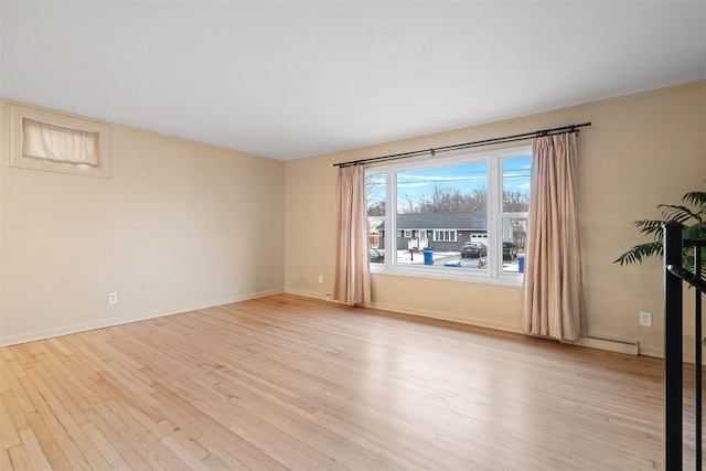 empty room with light wood-type flooring