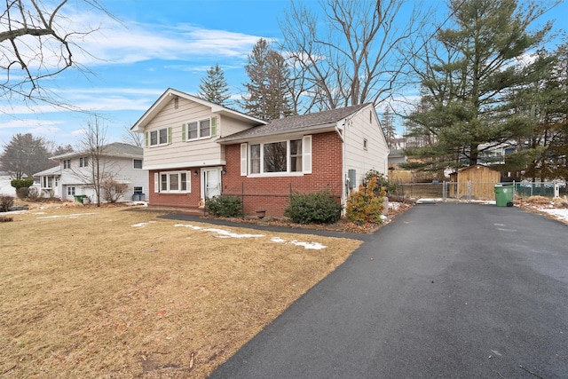 tri-level home featuring a front yard