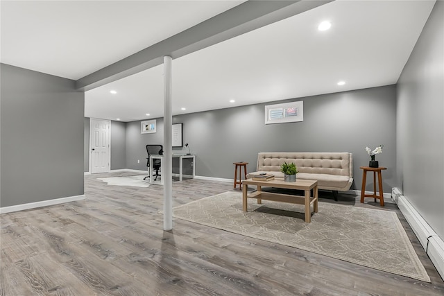 interior space with light hardwood / wood-style floors and baseboard heating