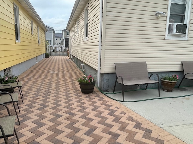 view of home's exterior featuring a patio and cooling unit