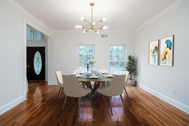 dining space with crown molding, hardwood / wood-style floors, and a notable chandelier