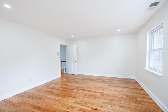 spare room with light hardwood / wood-style floors