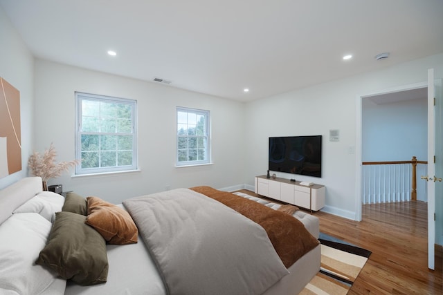 bedroom with hardwood / wood-style flooring