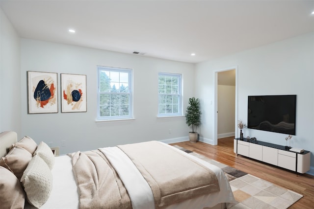 bedroom with light hardwood / wood-style flooring