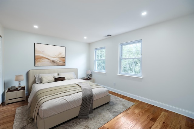 bedroom with wood-type flooring