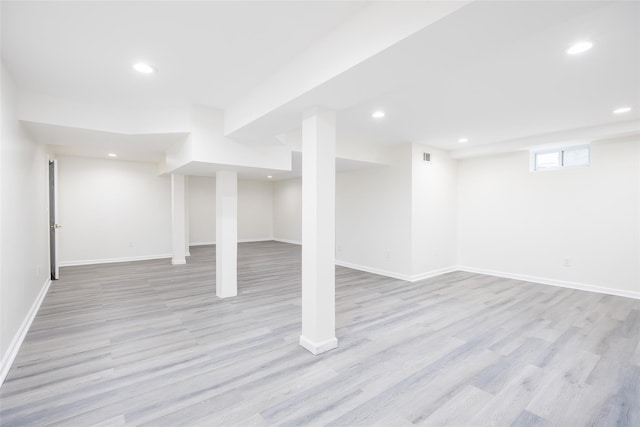 basement featuring light wood-type flooring