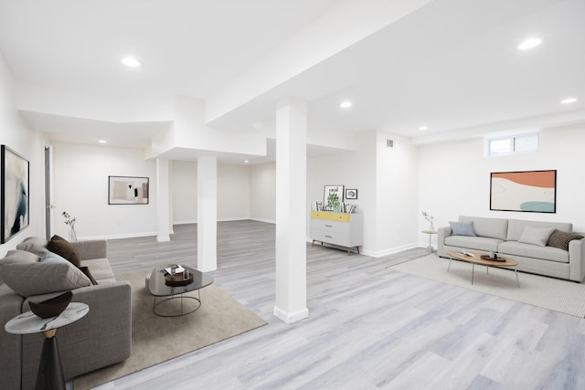 living room with light hardwood / wood-style flooring