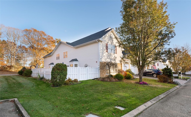 view of side of property featuring a lawn