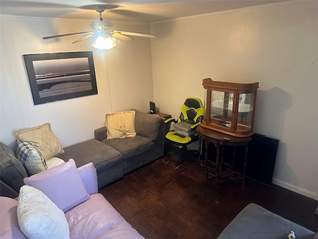 living room featuring dark parquet floors, ornamental molding, and ceiling fan