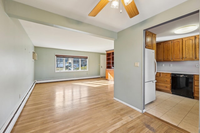 kitchen with dishwasher, a baseboard radiator, freestanding refrigerator, and brown cabinets