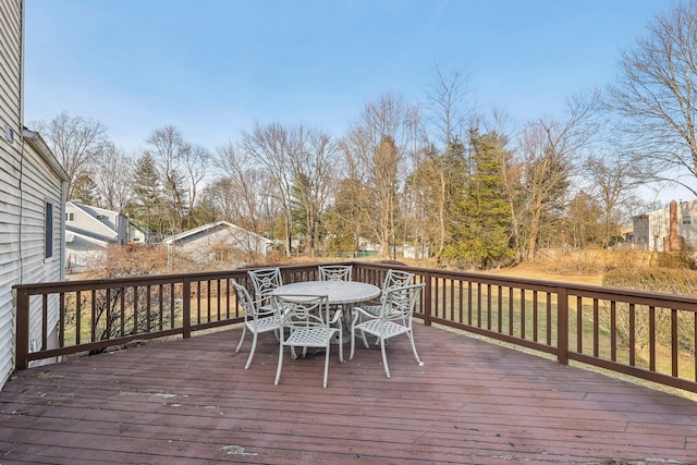 wooden deck with outdoor dining area