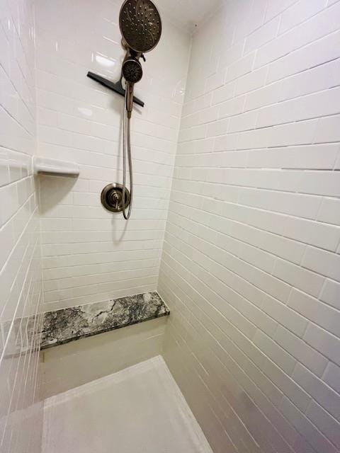 bathroom with tiled shower