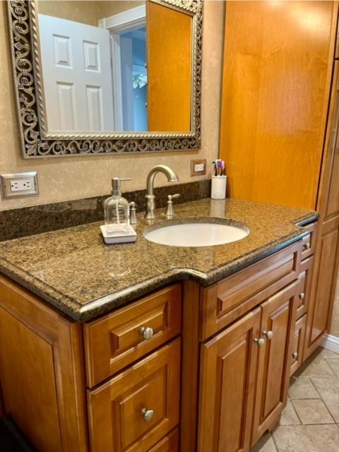 bathroom with vanity and tile patterned flooring