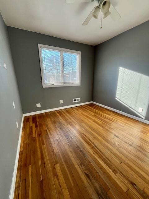 unfurnished room featuring wood-type flooring and ceiling fan