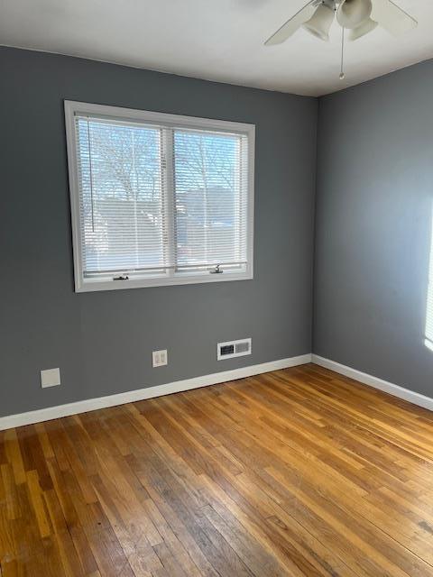 unfurnished room with ceiling fan and light hardwood / wood-style flooring