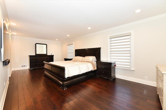 bedroom with dark hardwood / wood-style flooring and ornamental molding