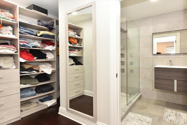 bathroom featuring vanity and a tile shower