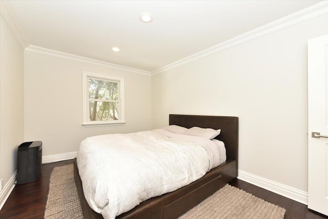 bedroom featuring ornamental molding and dark hardwood / wood-style flooring