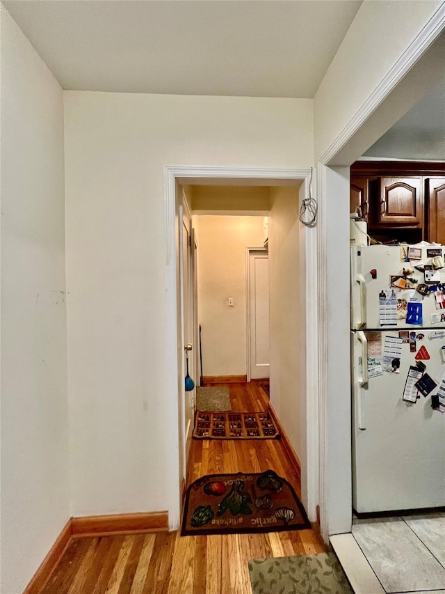 hallway with light wood-type flooring