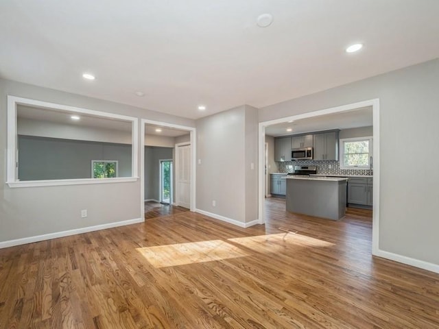 unfurnished living room with light hardwood / wood-style floors