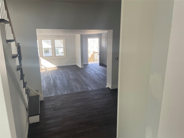 hallway with dark hardwood / wood-style floors