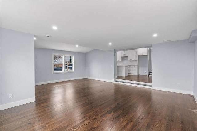 unfurnished living room with recessed lighting, visible vents, baseboards, and dark wood-type flooring