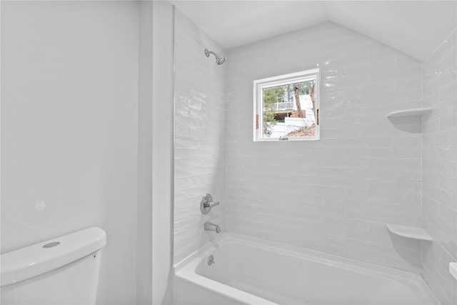 bathroom with toilet and washtub / shower combination