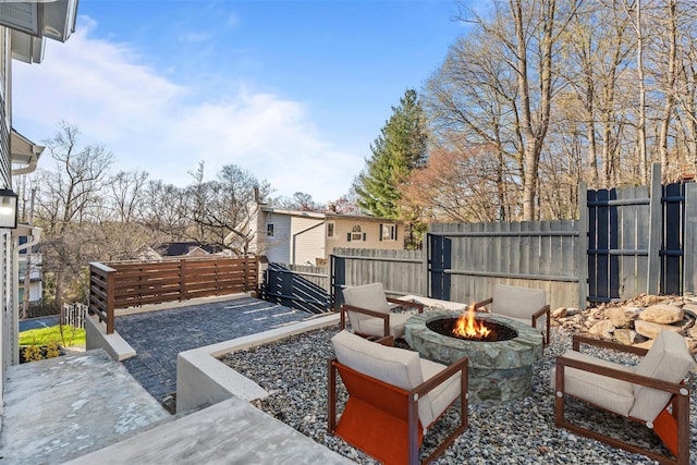 view of patio with a fire pit and a fenced backyard