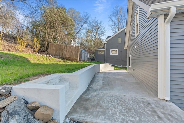 view of side of property with a patio