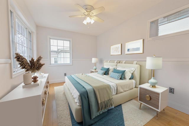 bedroom featuring ceiling fan and light hardwood / wood-style floors